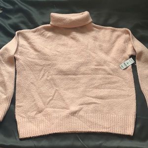 Light pink turtleneck, never worn, tags still on.
